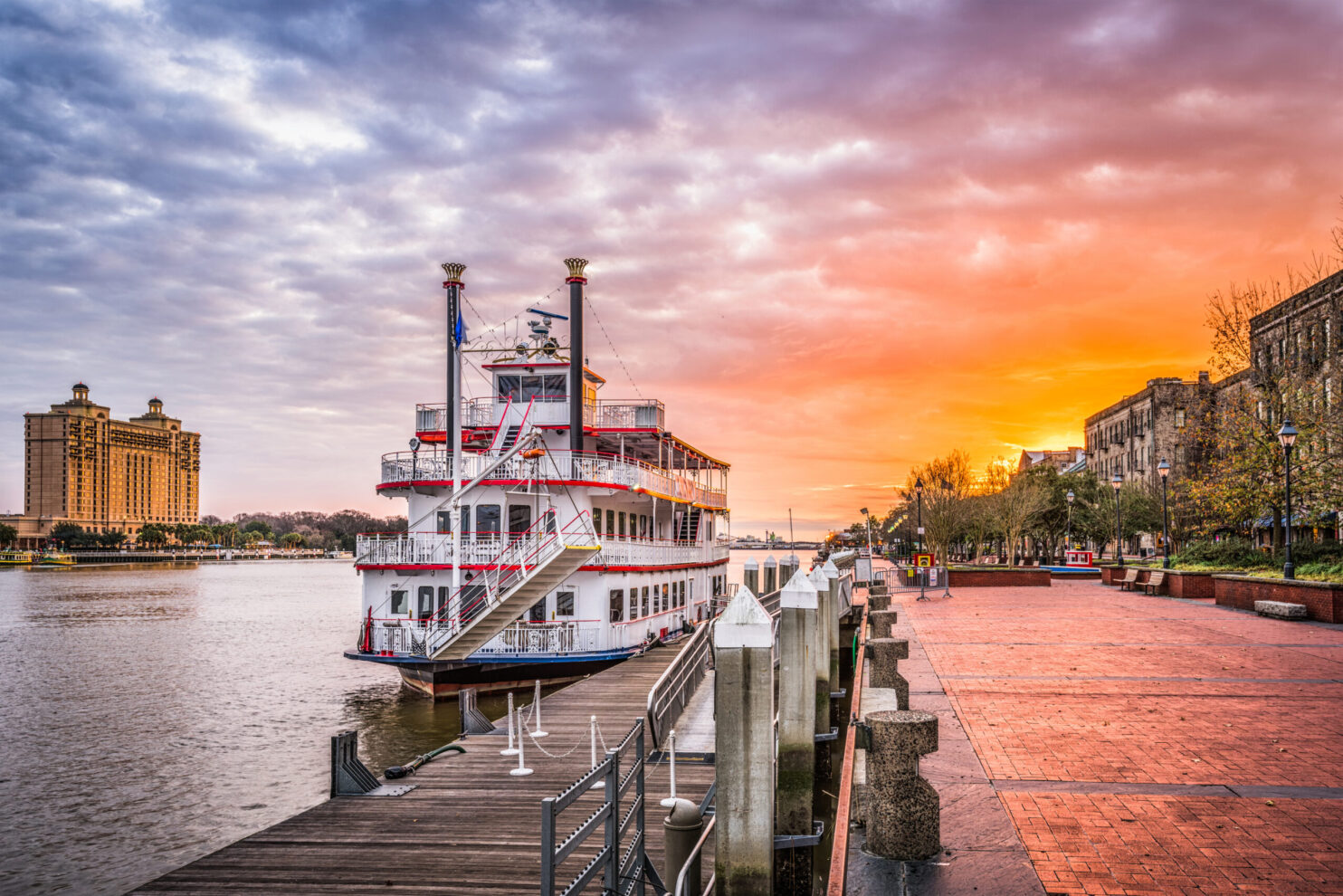 Savannah, Georgia, USA riverfront promenade at sunrise.